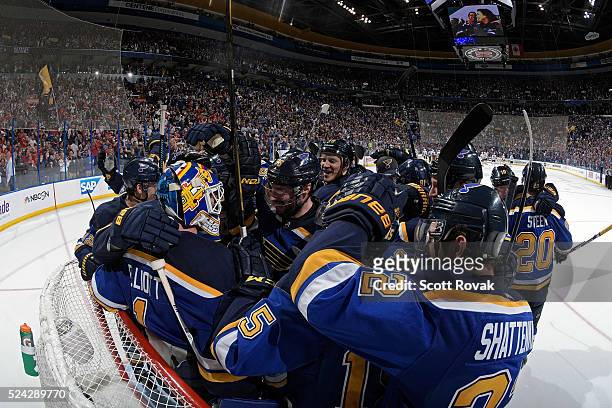 Brian Elliott and Troy Brouwer of the St. Louis Blues celebrate with teammates after defeating the Chicago Blackhawks 3-2 in Game Seven of the...