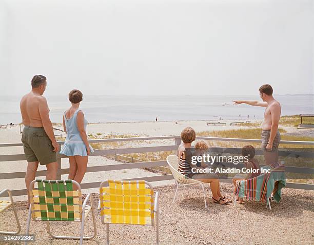 Vacationers at the Buccaneer Motel enjoy the view looking out towards the beach.