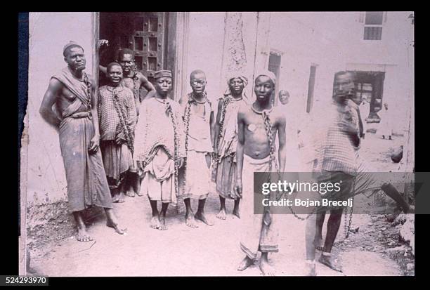 Slaves in chains on the island of Zanzibar in the 19th century. Slavery was abolished in March 5, 1873. Within twenty four hours the main slave...
