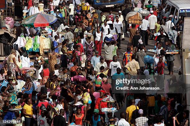 Pedestrians crowd a street in Freetown, Sierra Leone, December 9, 2008.