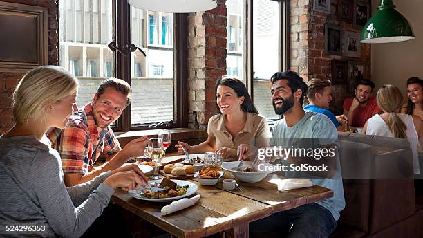 friends enjoying a meal - lunch break stock pictures, royalty-free photos & images