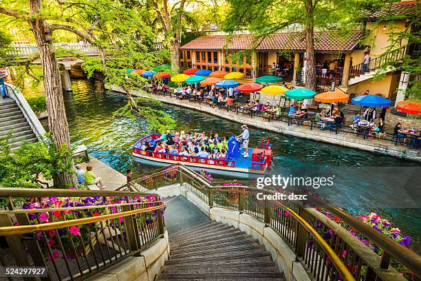 the riverwalk, san antonio park walkway scenic canal tour boat - san antonio stock pictures, royalty-free photos & images