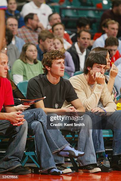 Kasey Kahne, driver of Evernham Motorsports Dodge, watches the game between the San Antonio Spurs and the Charlotte Bobcats at Charlotte Coliseum on...