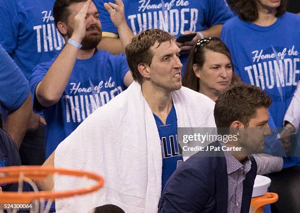 Dirk Nowitzki of the Dallas Mavericks watches the final seconds of Game Five of the Western Conference Quarterfinals against Oklahoma City during the...