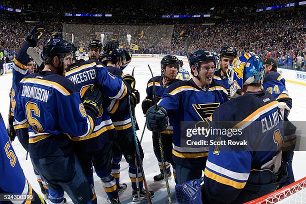 Vladimir Tarasenko of the St. Louis Blues celebrities with Brian Elliott after defeating the Chicago Blackhawks 3-2 in Game Seven of the Western...