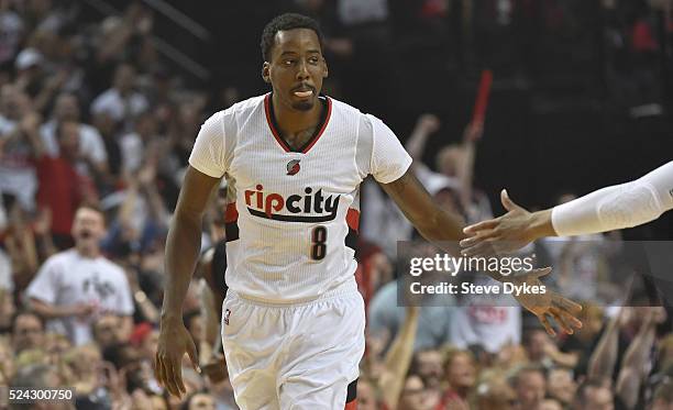 Al-Farouq Aminu of the Portland Trail Blazers celebrates with a teammate after hitting a three point shot in the first quarter of Game Four of the...