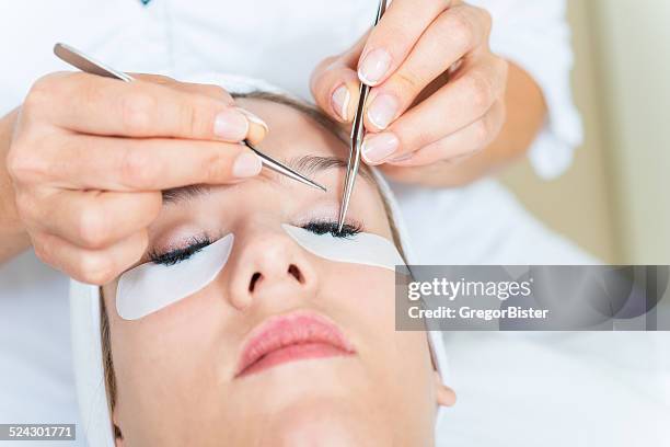 eyelash extensions - wimper stockfoto's en -beelden