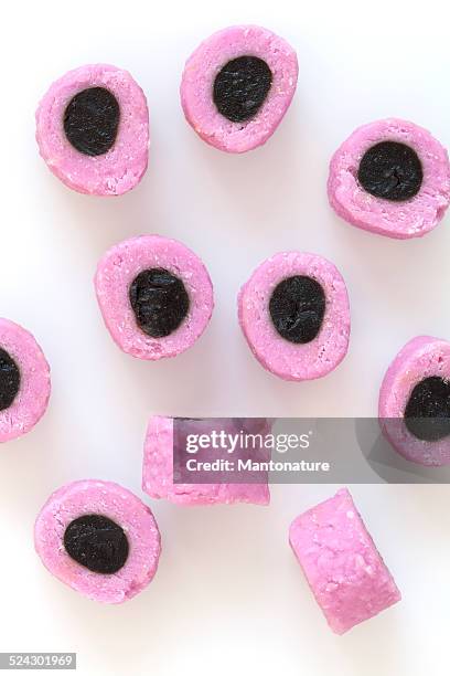 colourful liquorice candy on white - allsorts stock pictures, royalty-free photos & images