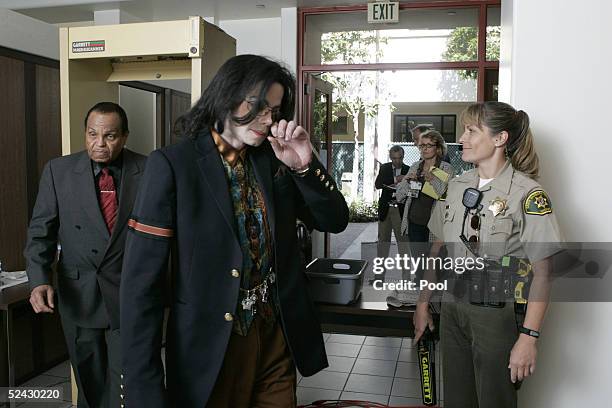 Singer Michael Jackson and his father, Joe Jackson , return to the courtroom after a break in testimony in the Michael Jackson child molestation...
