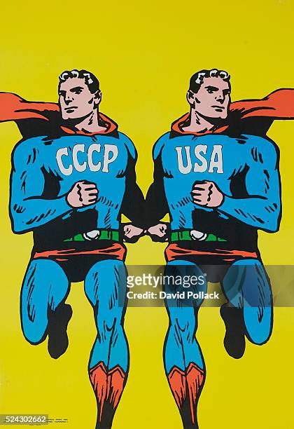 Protest poster illustrated by Roman Cieslewicz showing two identical Supermen, one with CCCP and one with USA marked on their costumes