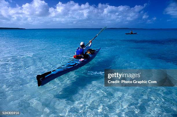 Member of an Outward Bound adult expedition ages 26 and over, kayaks open water on an 8 day sea kayaking course in the Exuma Islands of the Bahamas....