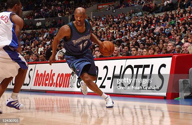 Sam Cassell of the Minnesota Timberwolves moves the ball against Lionel Chalmers of the Los Angeles Clippers during the game on February 24, 2005 at...