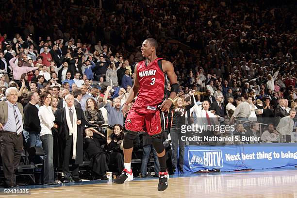 Dwyane Wade of the Miami Heat celebrates making the winning basket against the New York Knicks on March 15, 2005 at Madison Square Garden in New York...