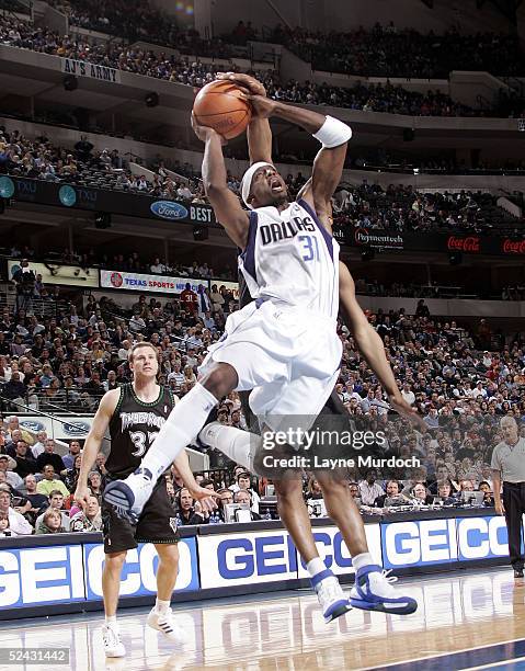 Sam Cassell of the Minnesota Timberwolves blocks the shot of Jason Terry of the Dallas Mavericks on March 15, 2005 at the American Airlines Center in...