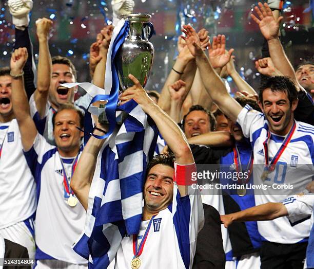 Greek players celebrate with the trophy.