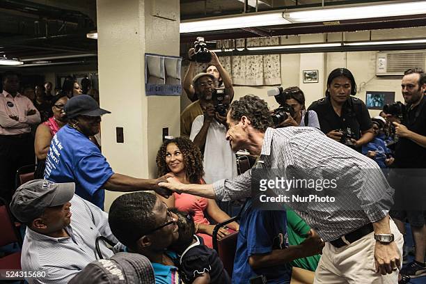 At a press conference, runs over to shake the hands of DIANE BEEBE, his host for the mayoral sleepover at Lincoln Houses in East Harlem. Photo: Kevin...