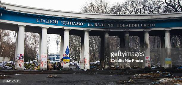 Protesters sit around the stove inside the colonnade of Dynamo stadium entrance, in Kiev, on February 11, 2014.