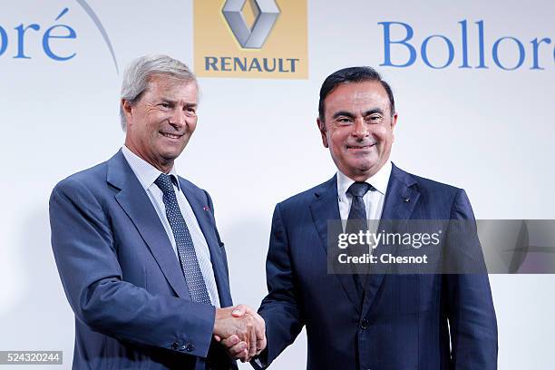 The CEO of French carmaker Renault, Carlos Ghosn, and French industrial group Bollore head Vincent Bollore give a press conference at the Atelier...