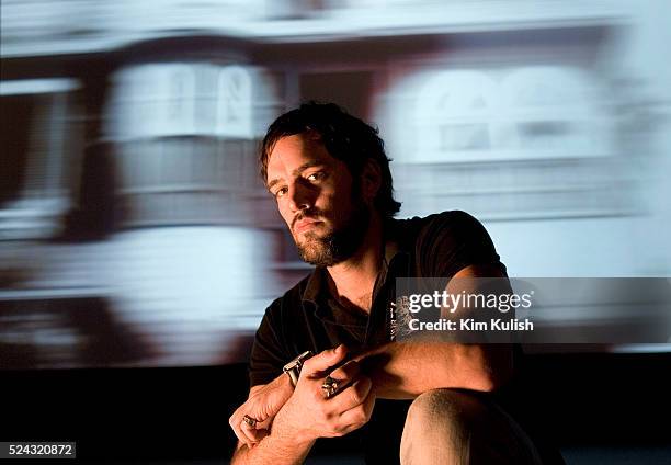 Jeremy Blake, a digital artist, poses near his newest 3-screen installation at San Francisco Museum of Modern Art based on the Winchester Mystery...