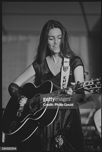 Emmylou Harris Playing an Acoustic Guitar
