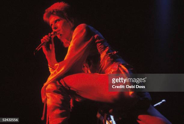 David Bowie performing as Ziggy Stardust at the Hammersmith Odeon, 1973.