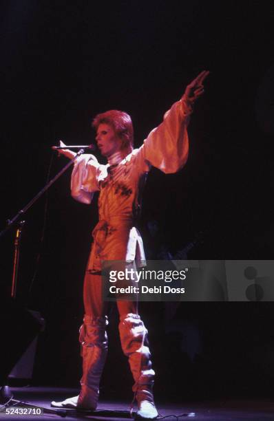 David Bowie performing as Ziggy Stardust at the Hammersmith Odeon, 1973.