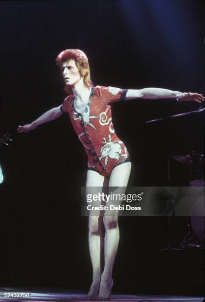 David Bowie performing as Ziggy Stardust, in his 'woodland creatures' costume designed by Kansai Yamamoto, at the Hammersmith Odeon, 1973.