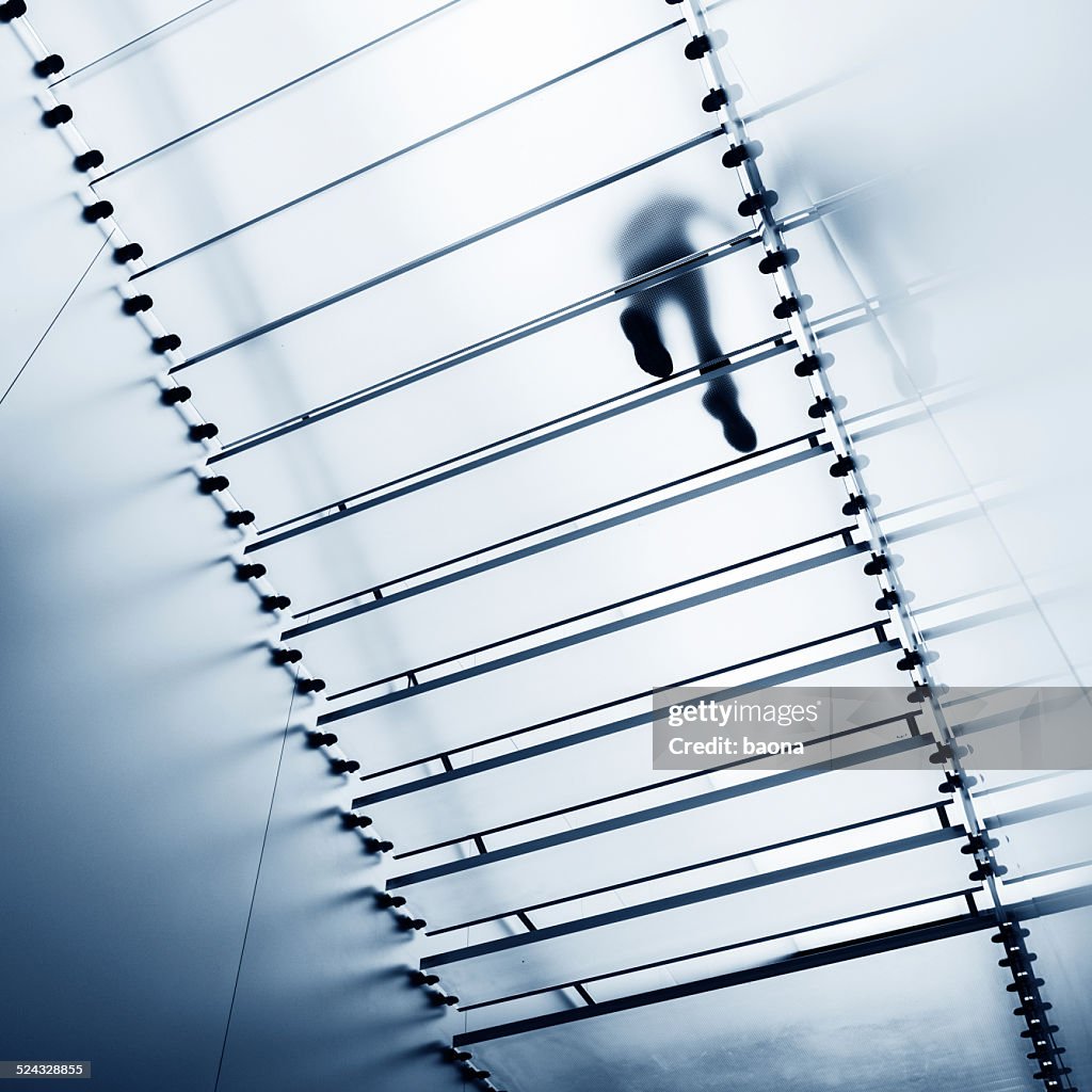 Walking on glass staircase