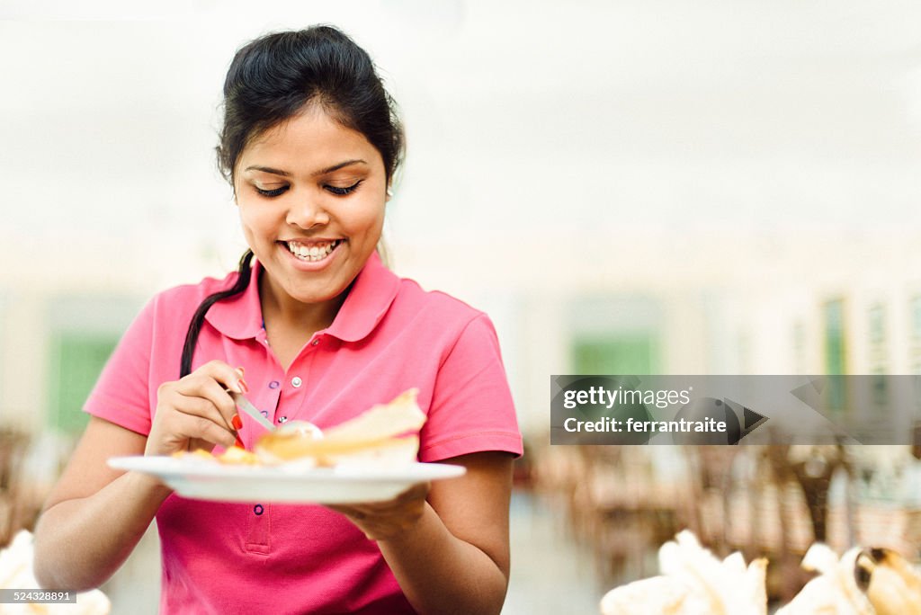 Indian female student in canteen buffet