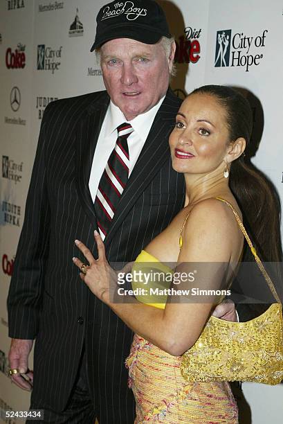 Former Beach Boy Mike Love and Designer Jacqueline Love arrive to City of Hope's "Rock the Runway" Benefit at H.D. Buttercup on March 15, 2005 in...