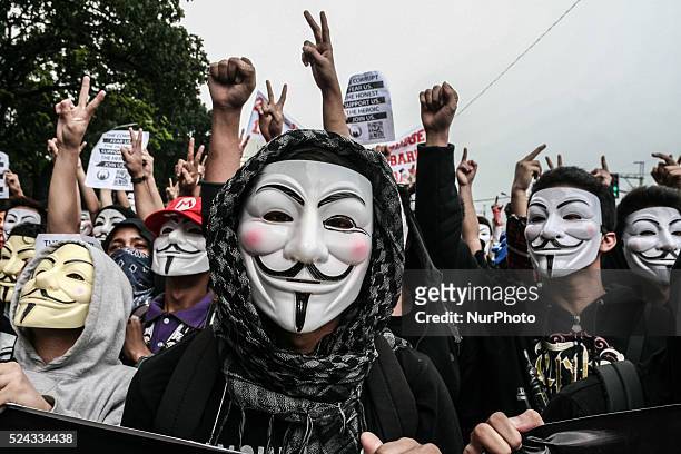 Anonymous Philippines members raise their hands in protest of the current status of the Pork Barrel issue involving several high ranking government...
