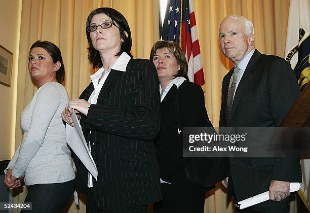 The sisters of murder victim Robert McCartney, Claire, Catherine and Paula leave after a news conference with U.S. Senator John McCain March 16, 2005...