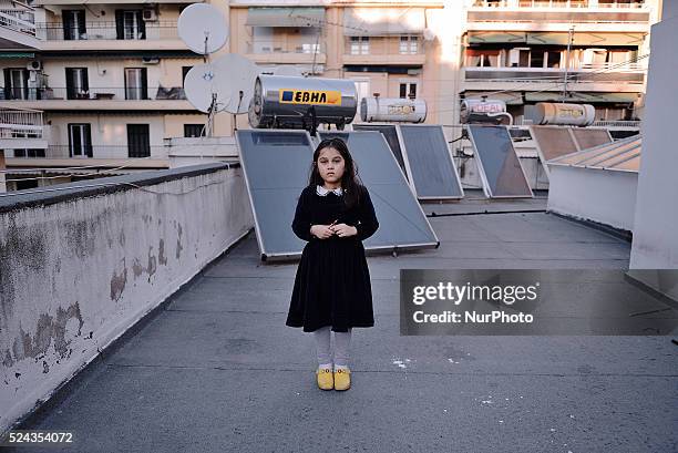 An Afghan refugee girl on the terrace of the building where her family lives. Due to its geographical position, Greece has the role of immigrants...