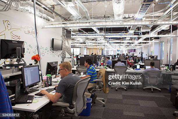 Scenes of daily work and life at Facebook , Inc. USA Headquarters in Menlo Park, California. View of employees at work in a typical unfinished...