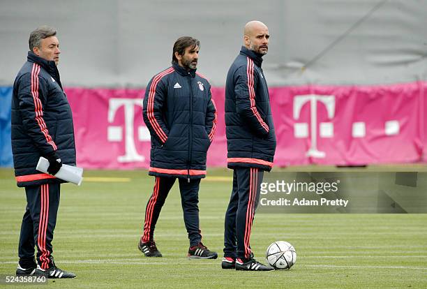 Josep Guardiola, Head Coach of Bayern Muenchen looks on during a training session ahead of the UEFA Champions League Semi Final First Leg between...