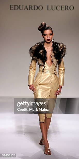 Model walks the runway at the Eduardo Lucero Fall 2005 show at Mercedes Benz Fashion Week at Smashbox Studios on March 16, 2005 in Culver City,...