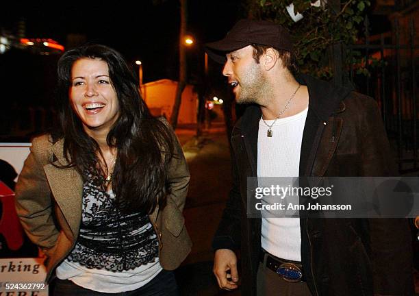 Patty Jenkins, screenwriter and director of the movie "Monster," speaks with friend and actor Jeremy Piven outside the restaurant Cafe des Artistes....