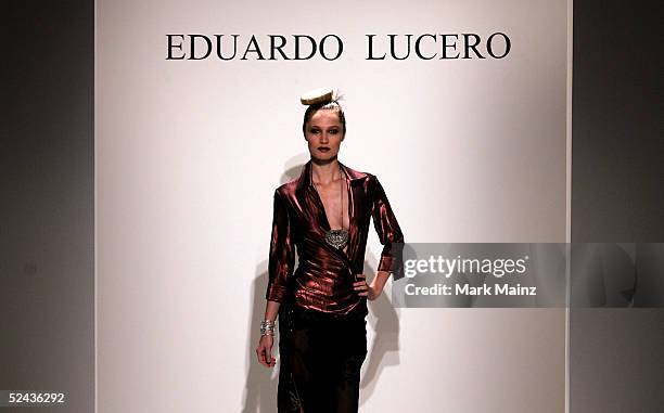 Model walks the runway at Eduardo Lucero Fall 2005 show at Mercedes Benz Fashion Week at Smashbox Studios on March 16, 2005 in Culver City,...