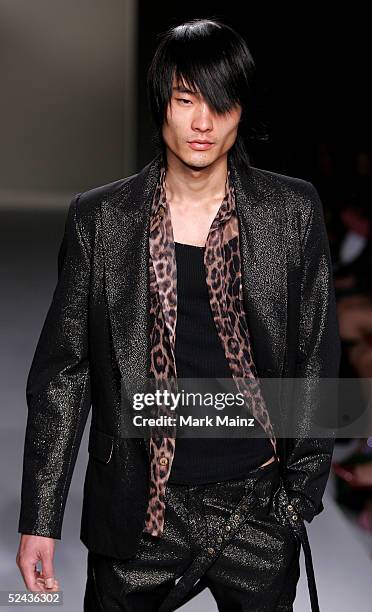 Model walks the runway at Eduardo Lucero Fall 2005 show at Mercedes Benz Fashion Week at Smashbox Studios on March 16, 2005 in Culver City,...