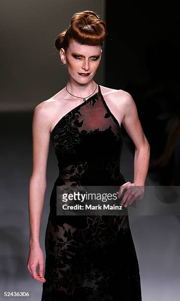 Model walks the runway at Eduardo Lucero Fall 2005 show at Mercedes Benz Fashion Week at Smashbox Studios on March 16, 2005 in Culver City,...