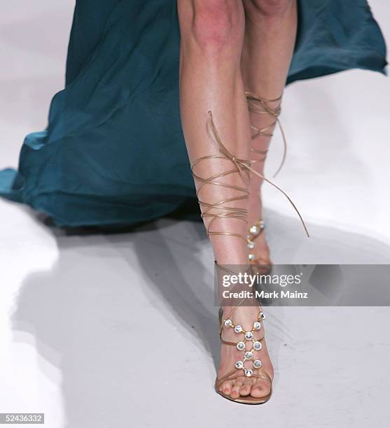 Model walks the runway at Eduardo Lucero Fall 2005 show at Mercedes Benz Fashion Week at Smashbox Studios on March 16, 2005 in Culver City,...