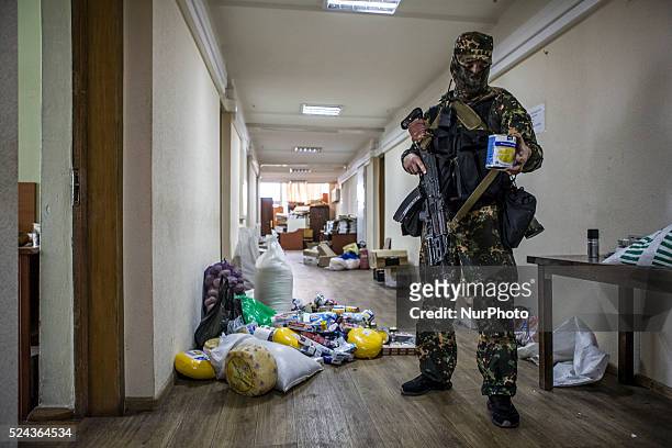 Heavily armed militiamen from the Vostok Battallion took over the Regional administration building in central Donetsk and cleared out the pro-Russian...