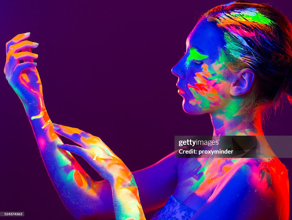 Woman Portrait Painted With Uv Makeup Color High-Res Stock Photo - Getty  Images