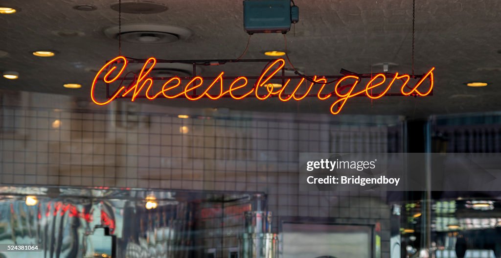 Illuminated neon Cheeseburger sign