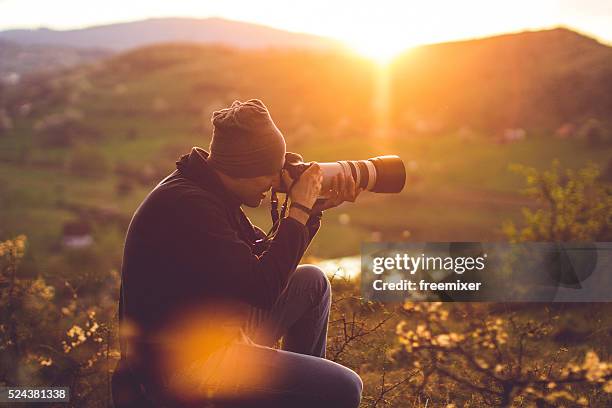 hiker taking photos - male photographer stock pictures, royalty-free photos & images