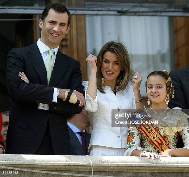 Prince Felipe and his wife Letizia are seen at the city hall balcony during the Mascleta of the fallas festival in Valencia 17 March 2005. AFP...