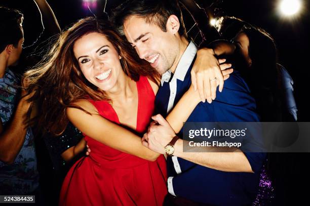 group of friends dancing and having fun together - night club foto e immagini stock