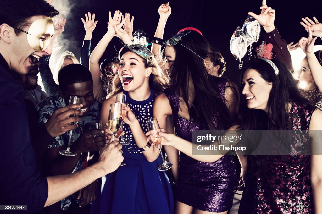 Group of friends dancing and having fun together