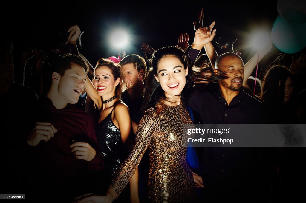 Group of friends dancing and having fun together