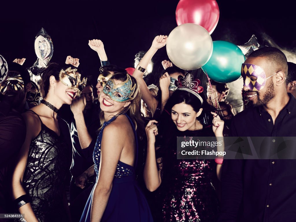 Group of friends dancing and having fun together